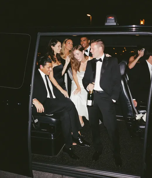 Wedding guests riding a shuttle bus to the venue