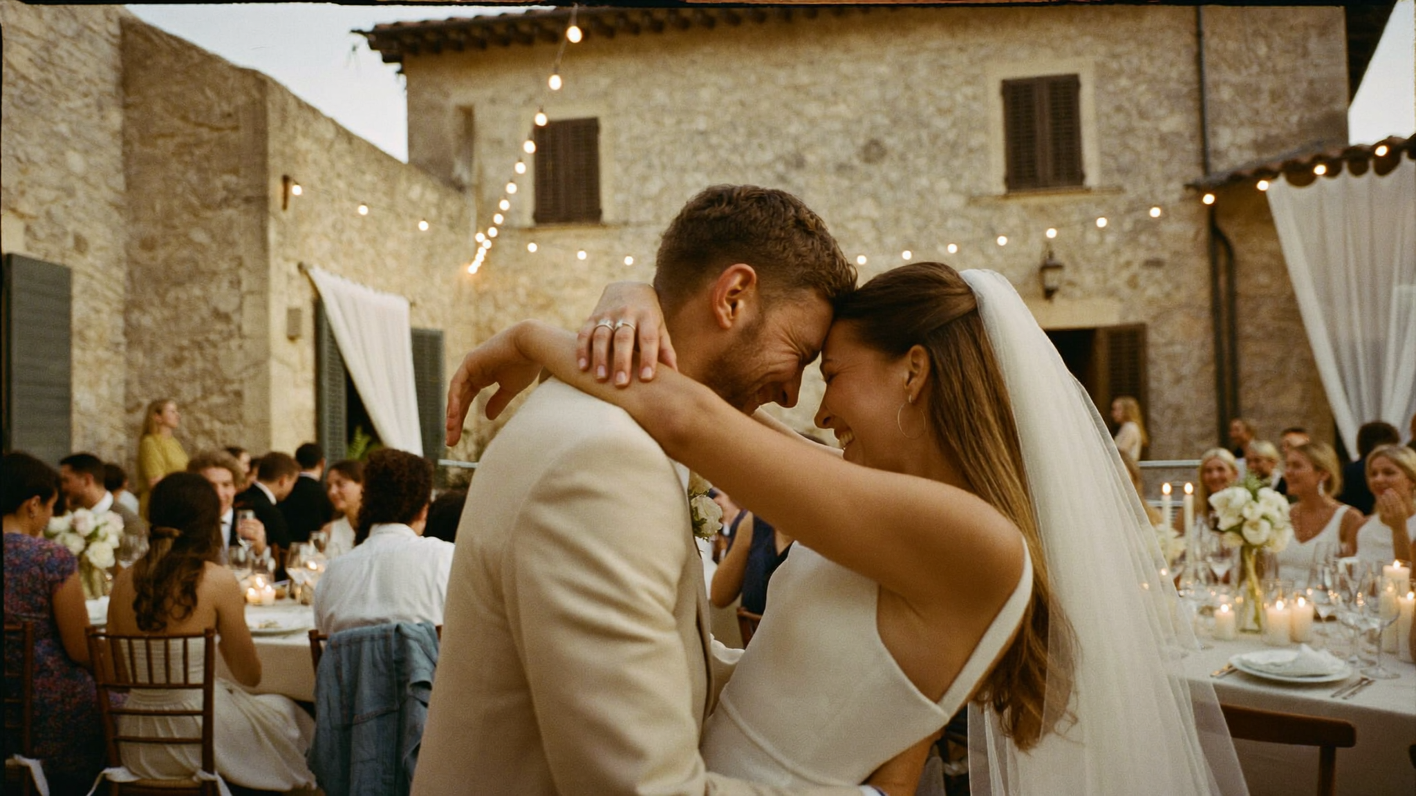A candid bride and father embrace at a Tuscan wedding
