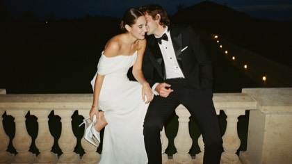 Couple on a stone balcony at night