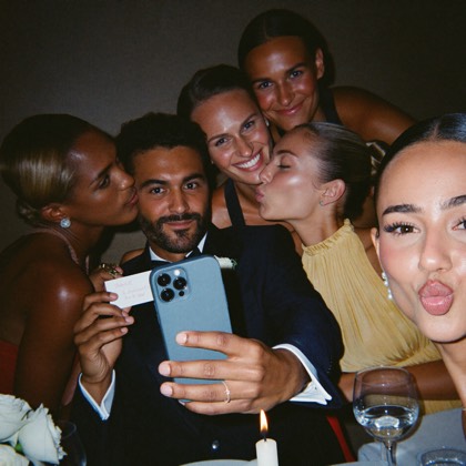 Guests taking a selfie at their reception table