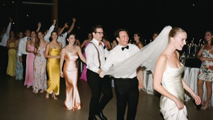 Guests dancing in a conga line